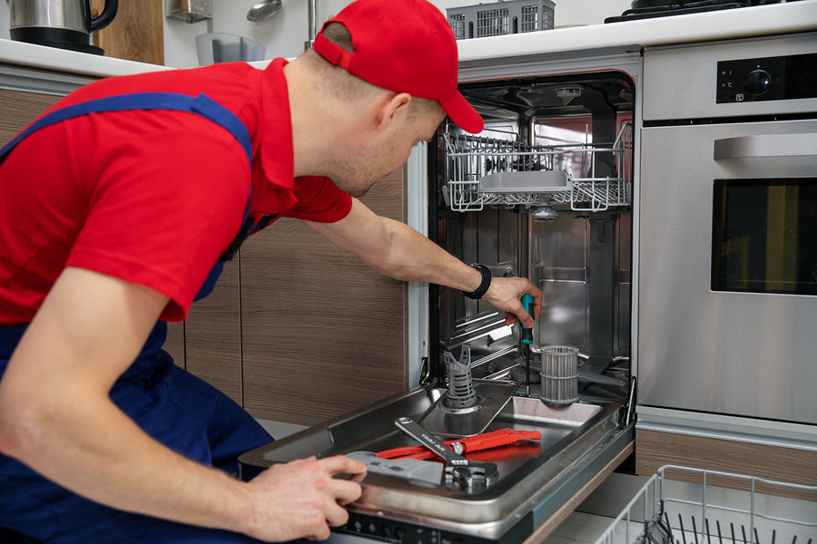 A man providing dishwasher repair services in Washington, DC