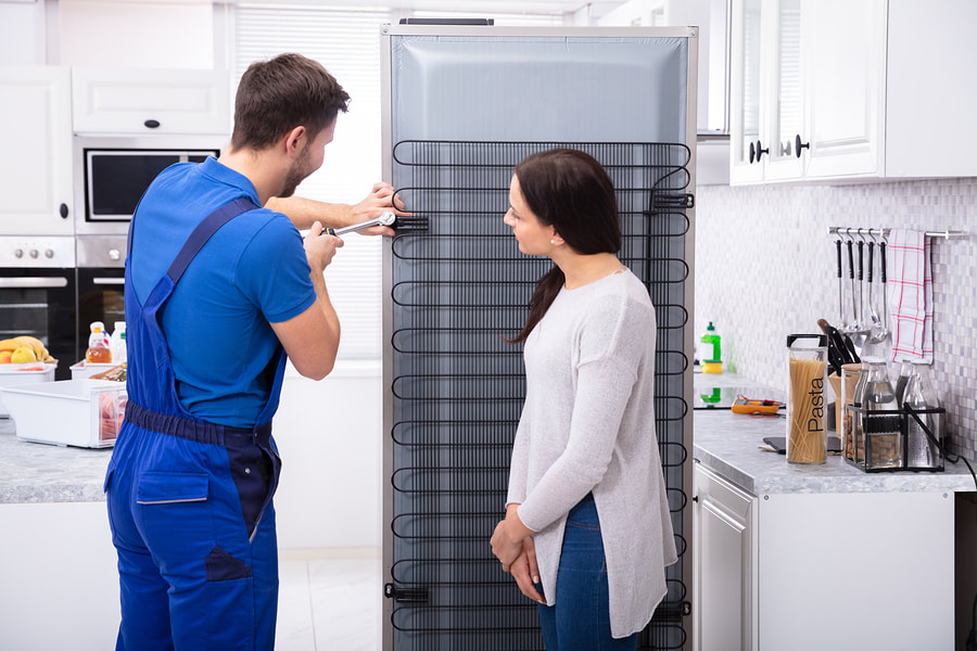 A man providing fridge repair services in Washington, DC
